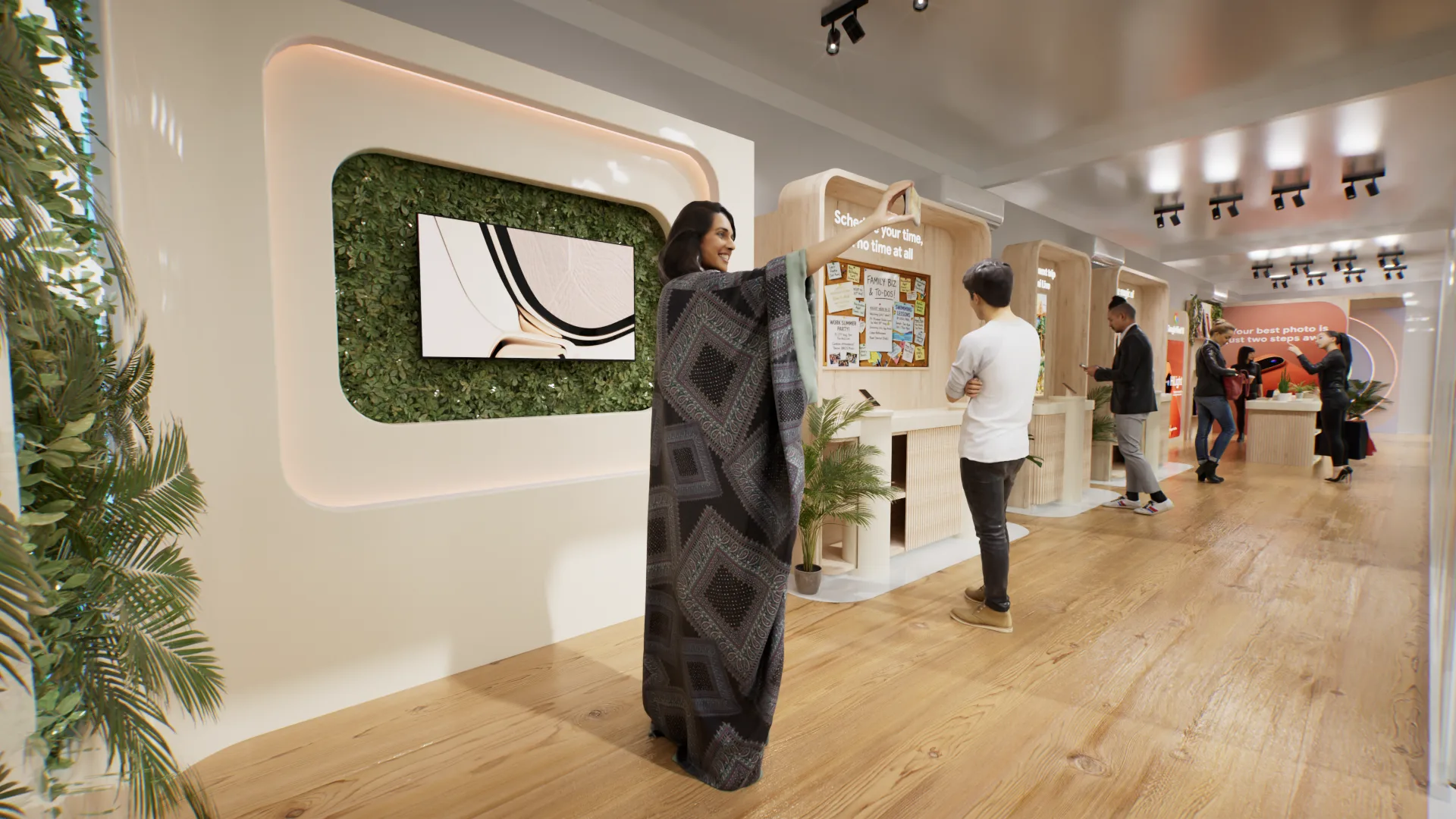 Entrée de l’espace Pixel : mur végétal, écran et visiteurs dans un couloir en bois clair.