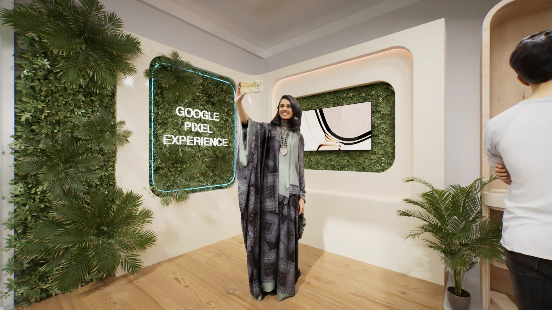 Mur d’accueil « Google Pixel Experience » encadré de végétation.