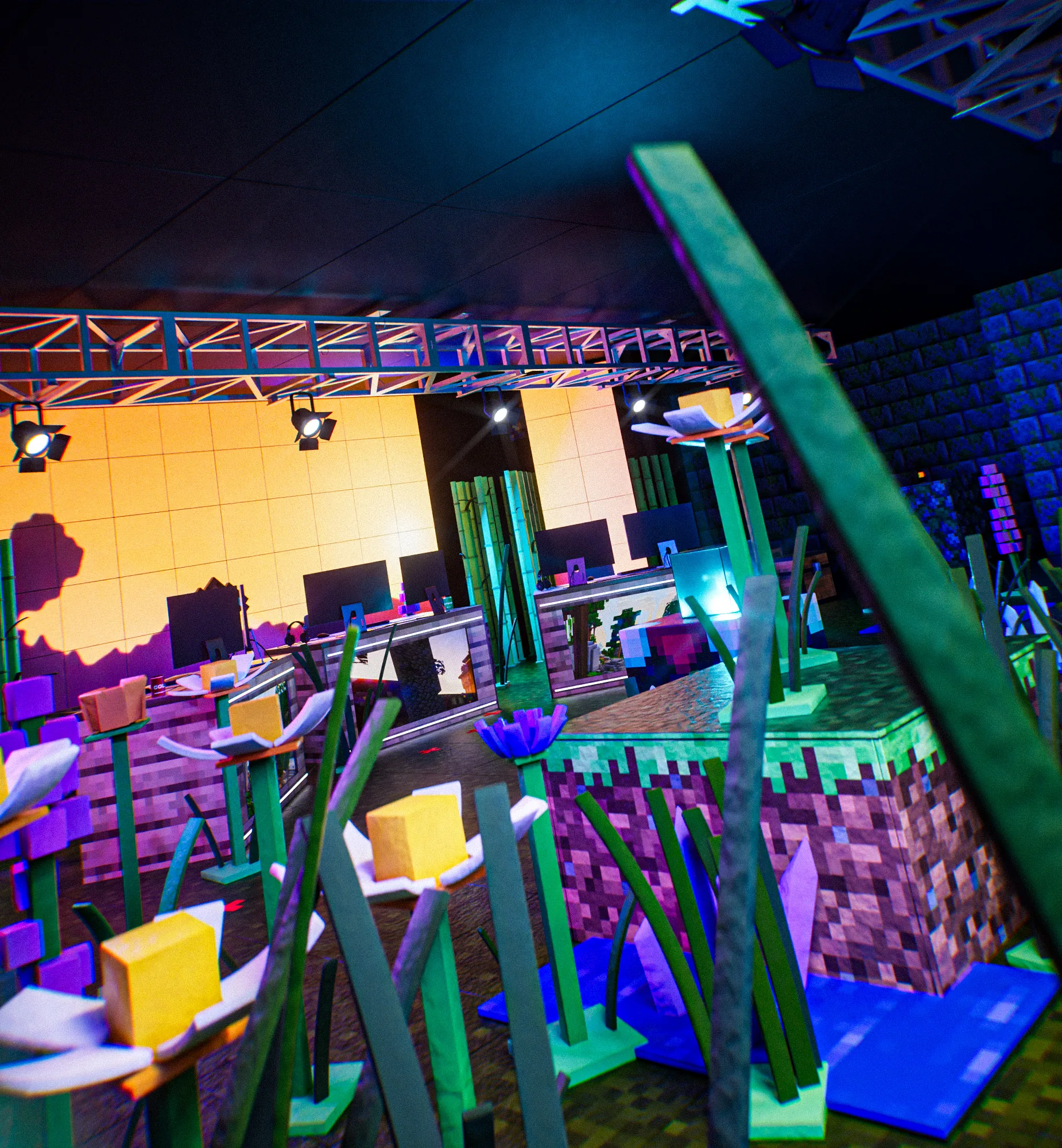 Side view of the set: yellow-centred flowers, a grass-block stage and an orange wall