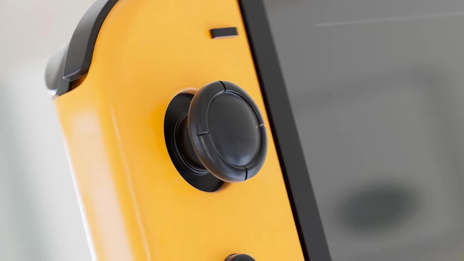 Gros plan sur le joystick du Joy-Con jaune.