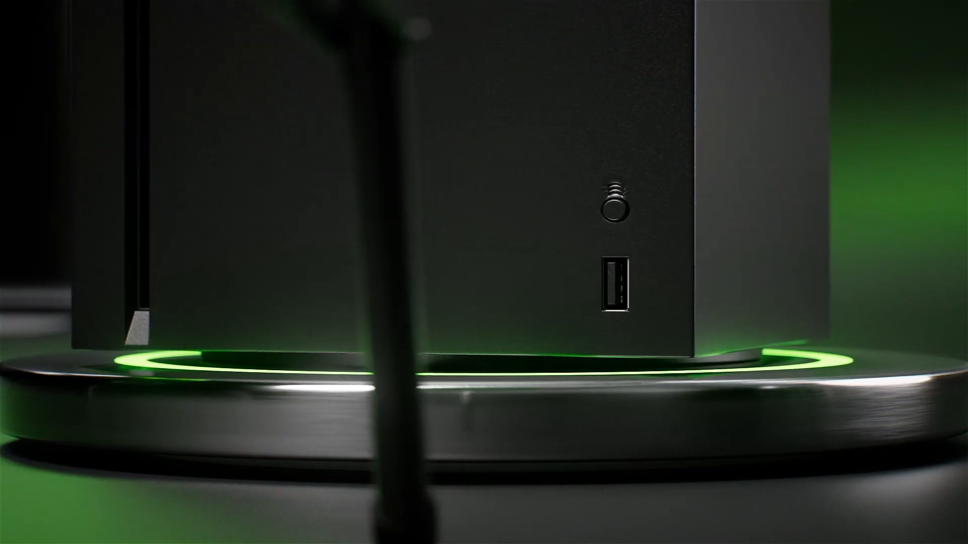 Silhouette de la Xbox Series X au-dessus d’un anneau lumineux vert.
